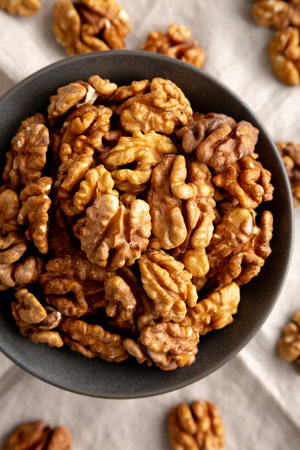Raw Walnut Halfs in a Bowl, top view. Flat lay, overhead. Close-up.の写真素材