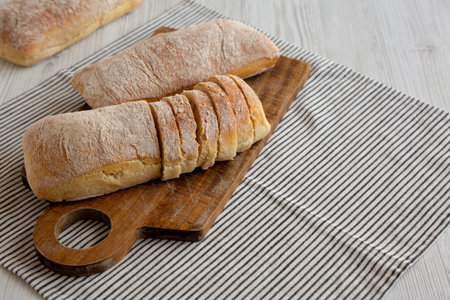 Homemade Ciabatta Bread on a wooden board, side view. Copy space.の写真素材