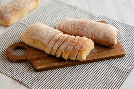 Homemade Ciabatta Bread on a wooden board, side view.の写真素材
