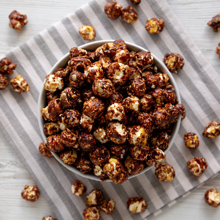 Homemade Chocolate Caramel Popcorn Ready to Eat in a Bowl, top view.の写真素材