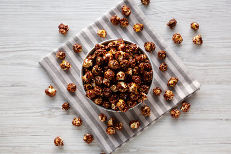 Homemade Chocolate Caramel Popcorn Ready to Eat in a Bowl, top view.の写真素材
