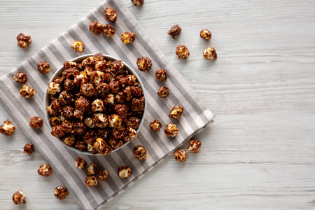 Homemade Chocolate Caramel Popcorn Ready to Eat in a Bowl, top view. Copy space.の写真素材