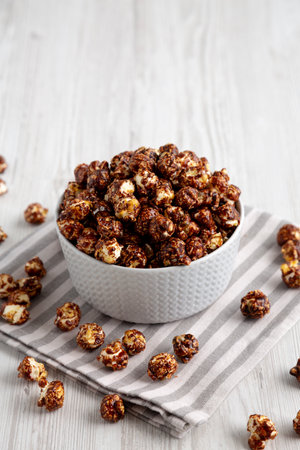 Homemade Chocolate Caramel Popcorn Ready to Eat in a Bowl, side view.の写真素材