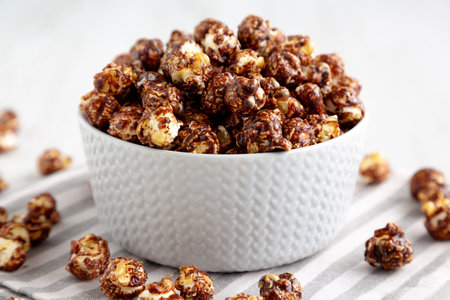 Homemade Chocolate Caramel Popcorn Ready to Eat in a Bowl, side view.の写真素材