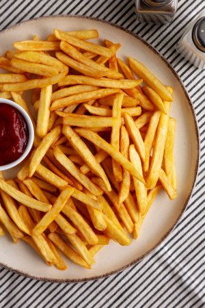 Homemade Golden French Fries with Ketchup, top view. Close-up.の写真素材