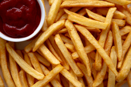 Homemade Golden French Fries with Ketchup, top view. Close-up.の写真素材