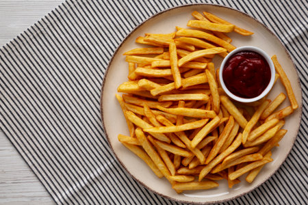 Homemade Golden French Fries with Ketchup, top view. Copy space.の写真素材