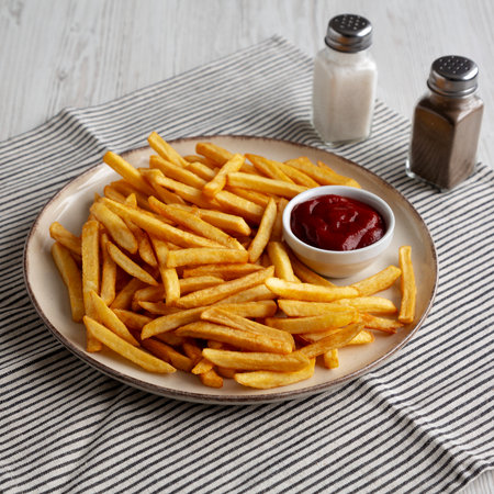 Homemade Golden French Fries with Ketchup, side view.の写真素材