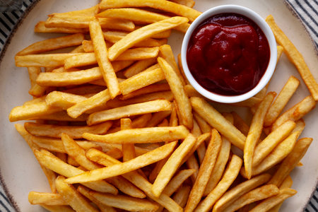 Homemade Golden French Fries with Ketchup, top view. Close-up.の写真素材