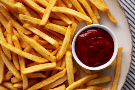 Homemade Golden French Fries with Ketchup, top view. Close-up.の写真素材