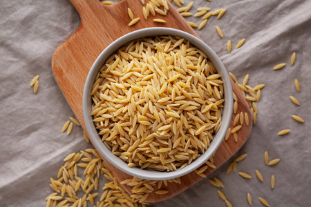 Organic Dried Orzo Pasta in a Bowl, top view.の写真素材