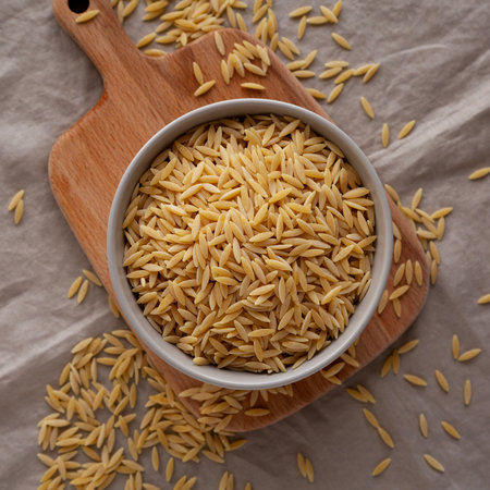 Organic Dried Orzo Pasta in a Bowl, top view. Close-up.の写真素材
