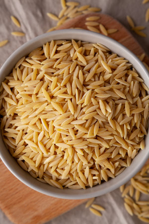 Organic Dried Orzo Pasta in a Bowl, top view.の写真素材