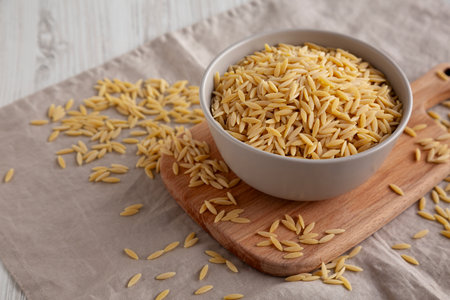 Organic Dried Orzo Pasta in a Bowl, side view.の写真素材