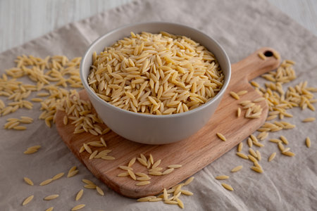 Organic Dried Orzo Pasta in a Bowl, side view.の写真素材