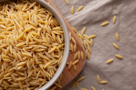 Organic Dried Orzo Pasta in a Bowl, top view.の写真素材