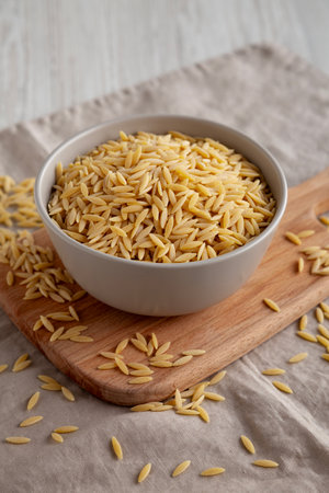 Organic Dried Orzo Pasta in a Bowl, side view.の写真素材