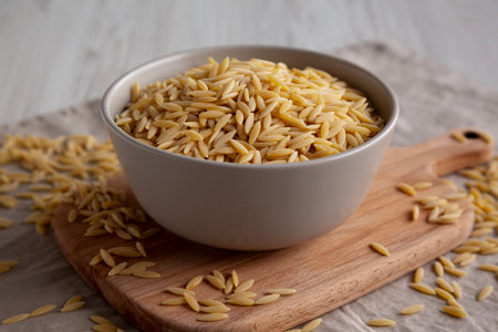 Organic Dried Orzo Pasta in a Bowl, side view.の写真素材