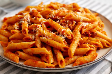 Homemade Pasta Bolognese with Cheese on a Plate, side view.の写真素材