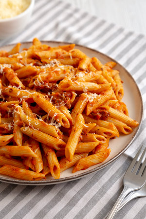 Homemade Pasta Bolognese with Cheese on a Plate, side view. Close-up.の写真素材