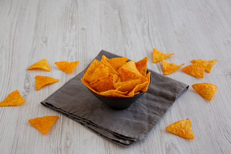 Crunchy Nacho BBQ Tortilla Chips in a Bowl, side view.の写真素材