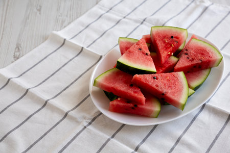 Raw Organic Watermelon Slices on a Plate, side view. Close-up.の写真素材