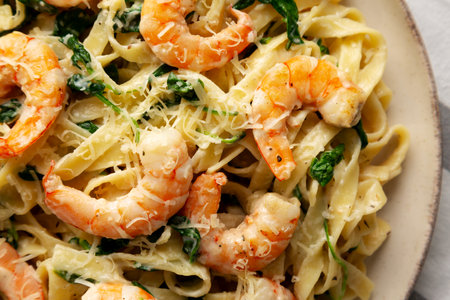 Homemade Creamy One-Pot Spinach Shrimp Pasta on a Plate, top view. Close-up.の写真素材