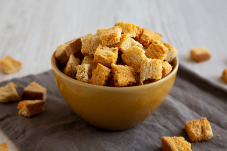Homemade Crispy Bread Croutons in a Bowl, side view. Close-up.