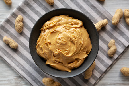 Organic Creamy Peanut Butter in a Bowl, top view.