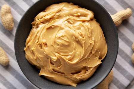 Organic Creamy Peanut Butter in a Bowl, top view.