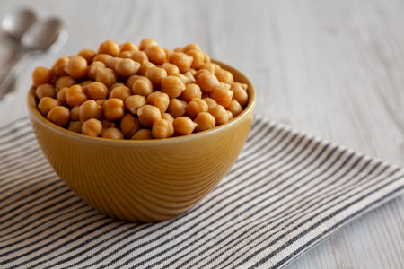 Organic Raw Canned Chickpeas in a Bowl, low angle view. Copy space.の写真素材