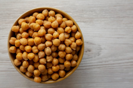 Organic Raw Canned Chickpeas in a Bowl, overhead view. Copy space.の写真素材