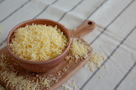Organic Grated Cheese Mix in a Bowl, side view. Copy space.の写真素材