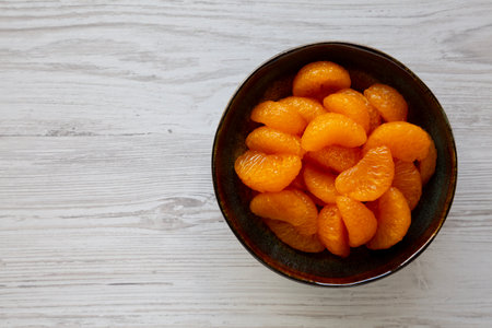 Organic Canned Mandarin Oranges in Bowls, top view. Copy space.の写真素材