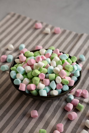 Fruity Colored Rainbow Marshmallows in a Bowl, side view.の写真素材
