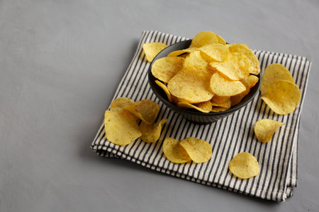 Sour Cream and Onion Flavored Chips in a Bowl, side view. Copy space.の写真素材