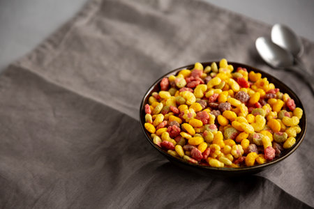 Fruity Kids Breakfast Cereal with Milk in a Bowl, side view. Copy space.の写真素材