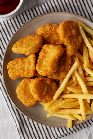 Chicken Nuggets with French Fries on a Plate, top view.の写真素材