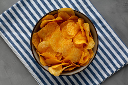 Crispy Cheese Potato Chips in a Bowl, top view.