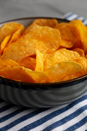 Crispy Cheese Potato Chips in a Bowl, side view.