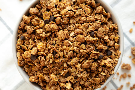 Tasty Homemade Chocolate Granola in a Bowl, top view. Overhead, from above.