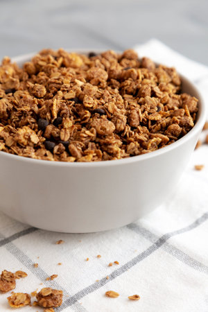 Tasty Homemade Chocolate Granola in a Bowl, side view. Close-up.