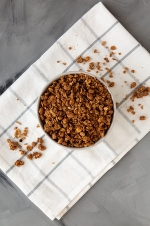 Tasty Homemade Chocolate Granola in a Bowl, top view. Overhead, from above.