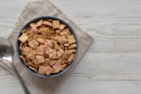 Sweet Strawberry Breakfast Cereal with Whole Milk in a Bowl, top view. Space for text.
