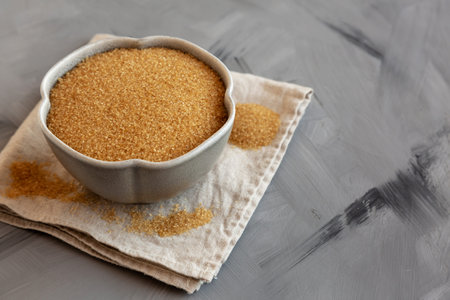 Raw Brown Sugar in a Bowl, side view.の写真素材