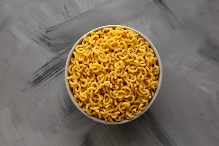 Organic Raw Dry Gramigna Pasta Ready to Cook in a Bowl, top view.