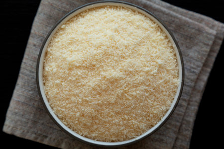 Organic Grated Parmesan Cheese in a Bowl, top view.の写真素材