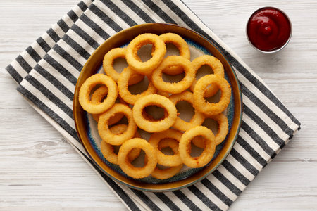 Homemade Crispy Fried Onion Rings Served with Ketchup