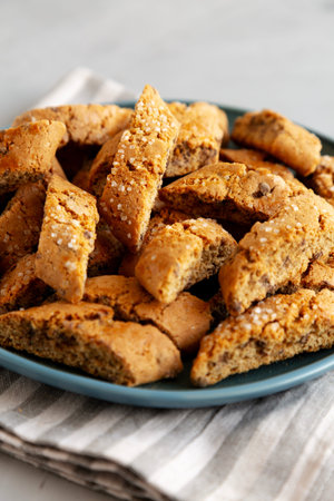 Homemade Chocolate Cantucci Pastry on a Plate, side view. Close-up.