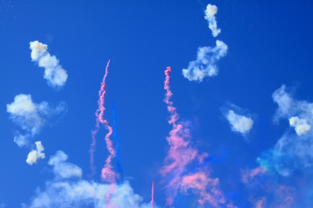 color smoke in the blue sky in a celebrationの写真素材